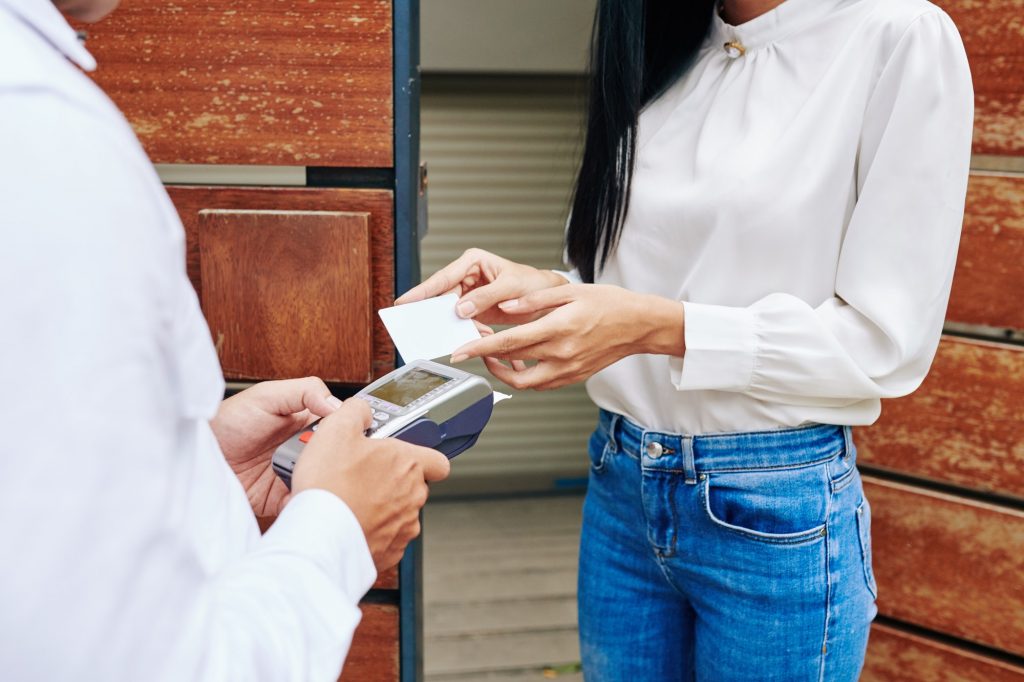 Woman Paying For Delivery
