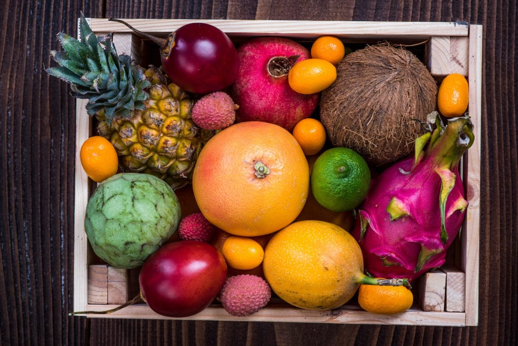 Wooden box with exotic fruits